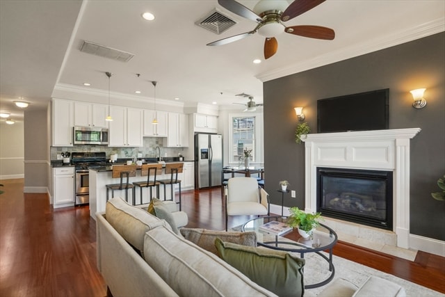 Open-concept kitchen and living area with fireplace