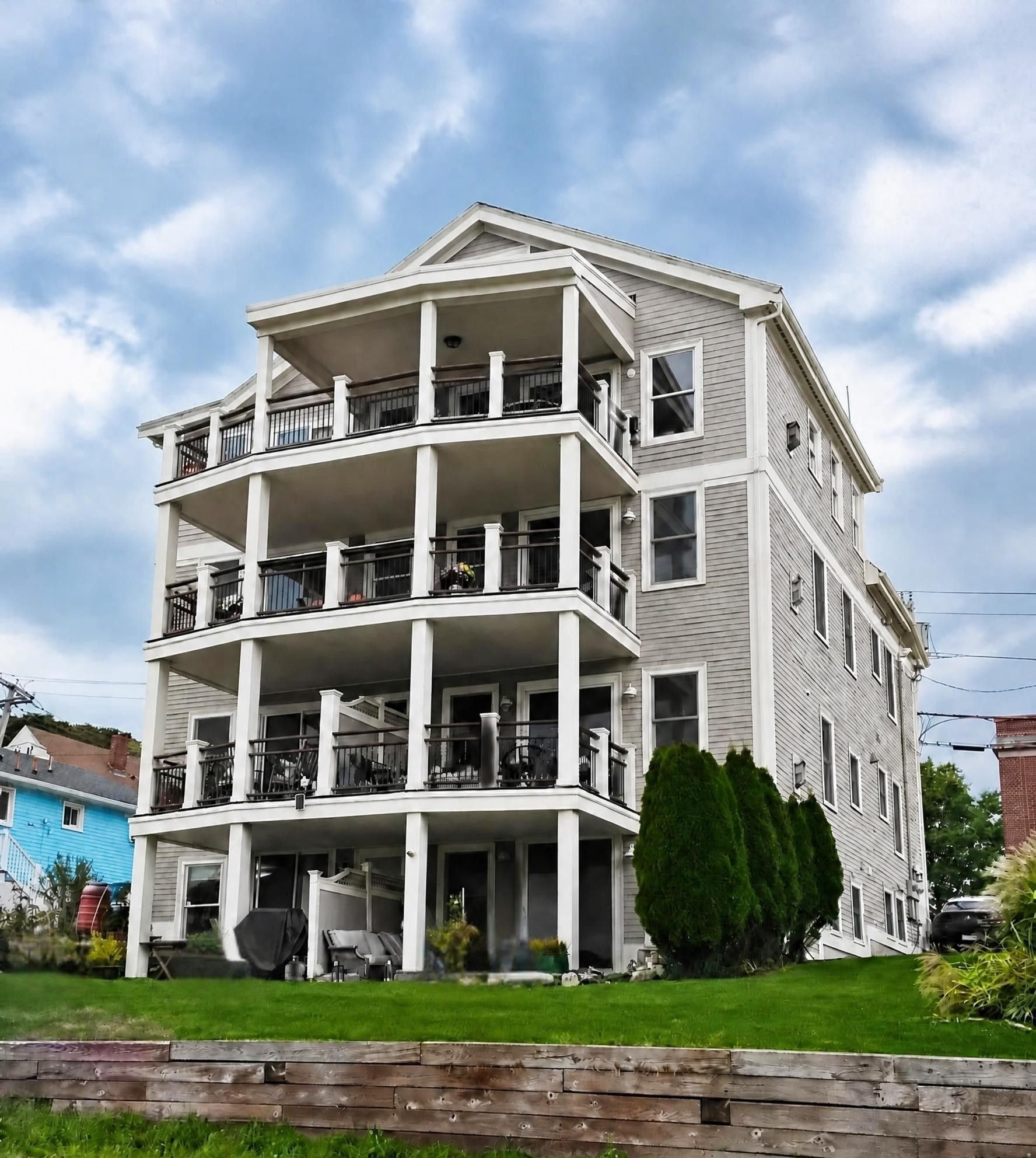Rear elevation with balconies and landscaping