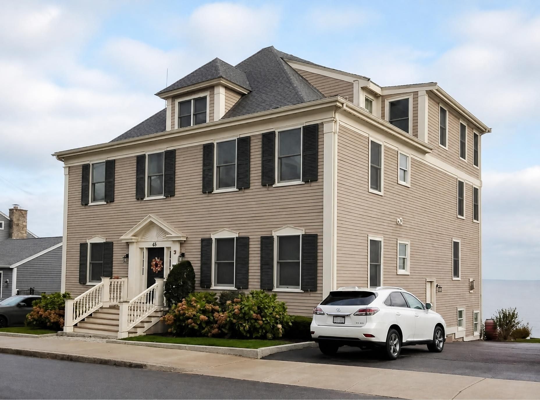 Beige colonial exterior with entry stair